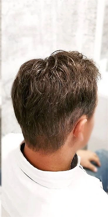After: finished short haircut from the same angled side view